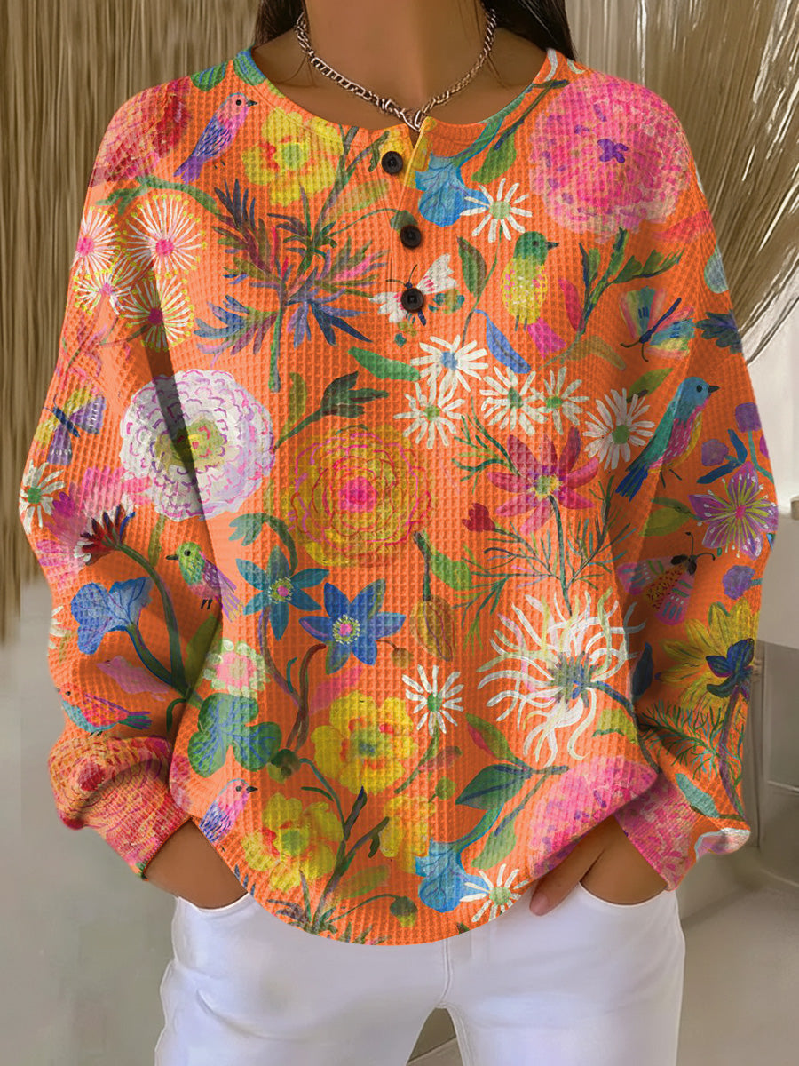 ウィブケ | 花柄のオレンジのプルオーバー