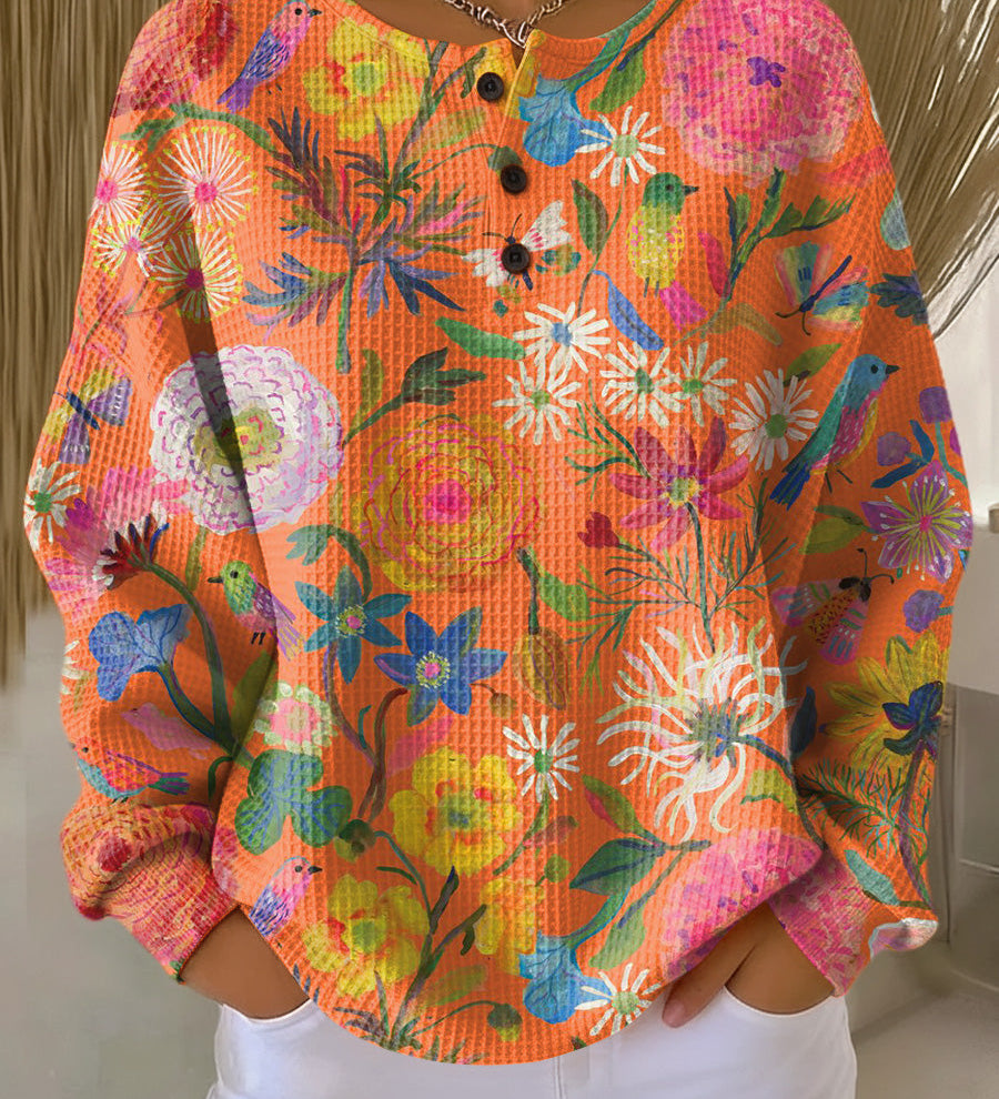 ウィブケ | 花柄のオレンジのプルオーバー